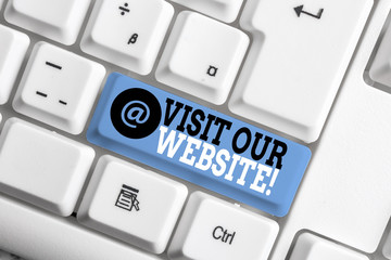 Text sign showing Visit Our Website. Business photo showcasing visitor who arrives at web site and proceeds to browse White pc keyboard with empty note paper above white background key copy space
