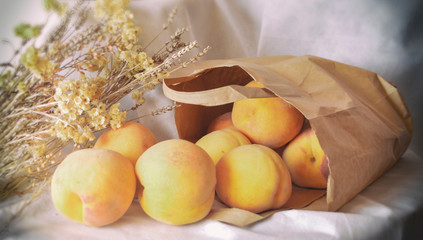 peach in paper bag