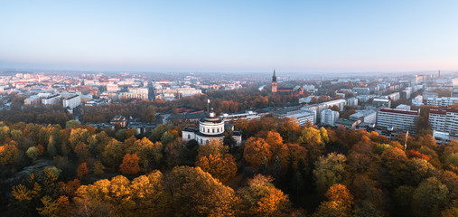 Aerial panorama of fall foliage and the city center with Turku Cathedral at autumn morning in Turku, Finland