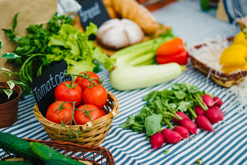 Close-up shot of autumn sale on farm market bright organic vegetables fruit and herbs on table. Health lifestyle, useful nutrition and shopping concept.
