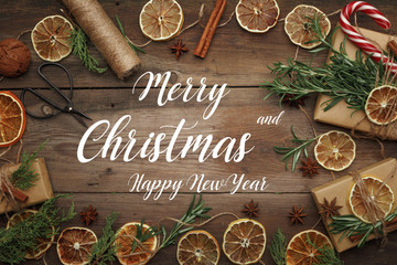 Christmas composition in rustic style on a wooden table. Top view.