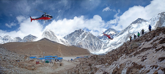 Everest base camp Gorak Shep rescue helicopters in action Himalayas Nepal, small settlement that sits at its edge at 5,164 m elevation, near Mount Everest - obrazy, fototapety, plakaty