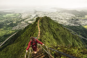 Fototapeten Dramatic views over Kaneohe hiking the Stairway to Heaven (Haiku Stairs) Oahu, Hawaii. © Nick