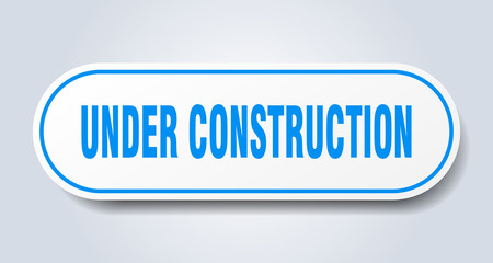 under construction sign. under construction rounded blue sticker. under construction