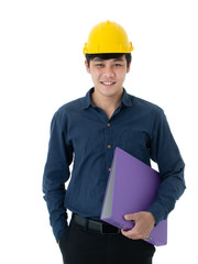 Portrait of young Asian engineer with yellow safety helmet hat standing and holding document file in hand isolated on white background with copy space. Career, construction and home design concept.