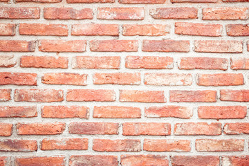Orange brick wall concrete or stone texture background, wallpaper limestone abstract to flooring and homework/Brickwork or stonework clean grid uneven interior rock old.