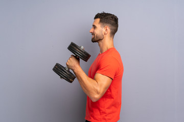 Young sport man making weightlifting