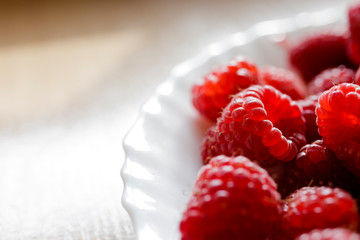Raspberries in a white plate
