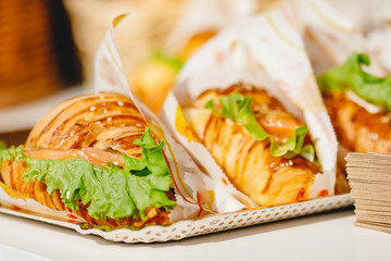Sandwich croissants with green salad and jamon meat, european breakfast. Catering concept