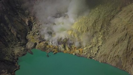 Aerial: Landscape view of Ijen volcano and lake. The most famous tourist attraction in Indonesia