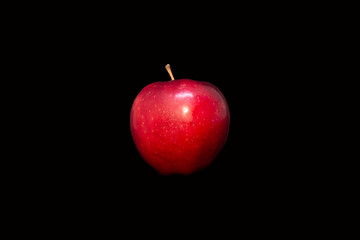 red apple isolated on the black background