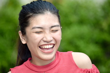 Fototapeta premium An Asian Girl And Laughter