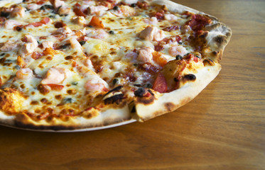 Pizza with seafood. Mozzarella, tuna and shrimps.