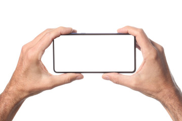 male man holding and showing  blank smart phone isolated  on white background  with clipping path around hand and display with copy space for your text