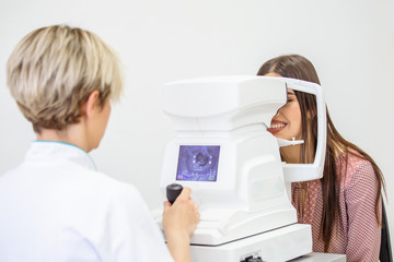 Slit Lamp eye control with the Ophthalmologist / handsome man during a contact lenses examining/...
