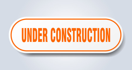 under construction sign. under construction rounded orange sticker. under construction