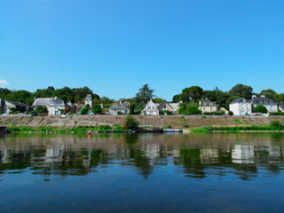 view of the town from a boat while traveling on the Loire