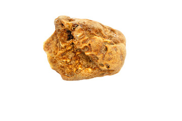 A piece of natural amber of an unusual shape with holes on a white background. Amber resin. Fossilized ancient frozen piece of wood resin. Sun stone. Material for jewelers. Digging. Crystal Mineral. 