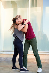 Young couple enjoying first date, dancing outdoors