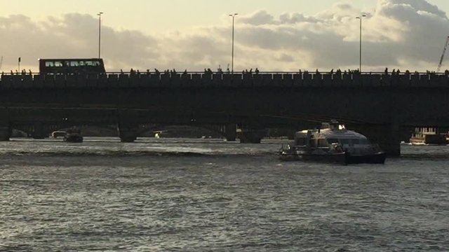 London commuters and people walking to Waterloo Bridge train at rush hour stock footage video