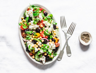 Greek chickpeas salad on light background, top view. Vegetarian healthy diet food