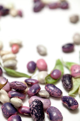 Multicolored beans on white background