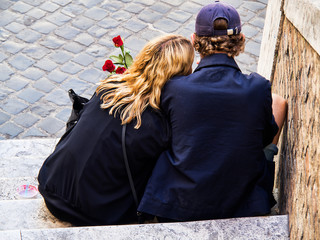 Lovers embraced on a staircase