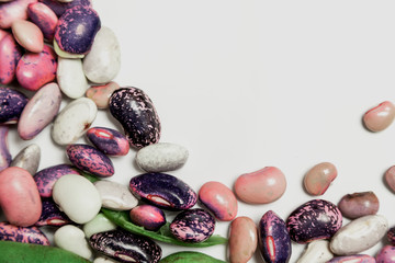 Multicolored beans on white background
