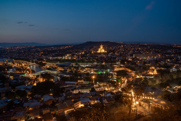 Night view of Tbilisi with Sameba (Trinity) Church and other landmarks. Beautiful Place to travel.