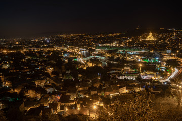 Night view of Tbilisi with Sameba (Trinity) Church and other landmarks. Beautiful Place to travel.