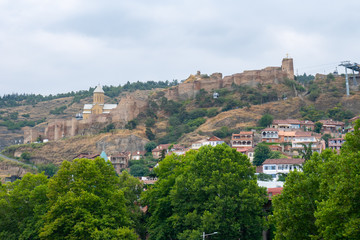 Fototapeta na wymiar Ancient ruins of Narikala fortress on a high mountain in Tbilisi.