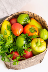 fresh vegetables in basket isolated on white