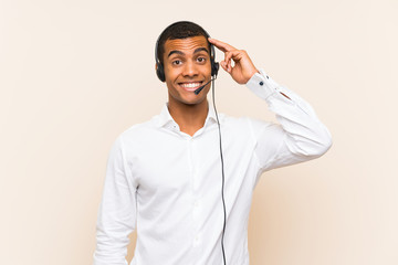 Young brunette man working with a headset intending to realizes the solution