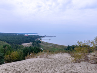 panoramic sea view in the distance, dunes in the foreground