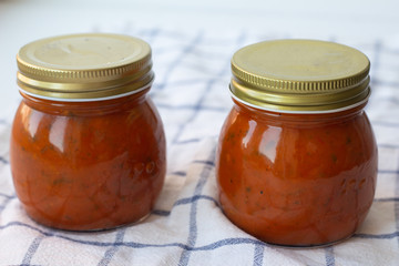 tomato sauce with herbs in a jar 