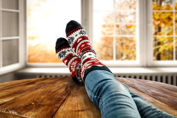 Autumn socks and open fall window background. Free space for your decoration. 