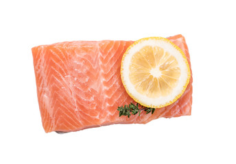 Steak of red fish, salmon with lemon, rosemary and thyme. Trout on white background.
