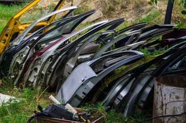 Disassembled parts from old cars. Old spare parts for cars.