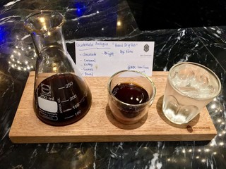 cup of coffee and beans on table