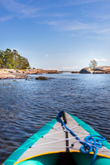 Kayaking at sea with rocky coast. Ausflug mit Kajak mit Felsenk&uuml;ste.