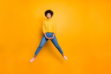 Fototapeta na wymiar Full length body size photo of cheerful charming pretty cute sweet girlfriend wearing jeans denim footwear jumper jumping up with lips pouted isolated vivid color background