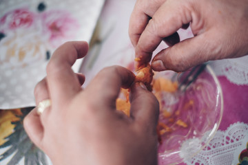 Hands peeling off and eating shrimps. Selective focus. 