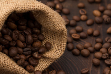 Coffee bean in bag on wood