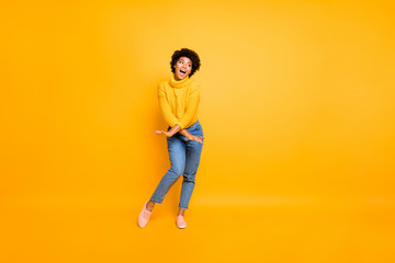 Full length body size photo of cheerful resting attractive crazy black girlfriend wearing jeans denim jumper spending holiday dancing in footwear isolated bright color background