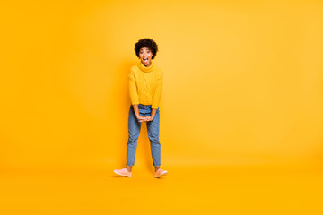 Fototapeta na wymiar Full length body size view of nice attractive cheerful cheery funky childish crazy wavy-haired girl having fun leisure isolated over bright vivid shine vibrant yellow color background