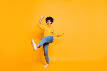 Fototapeta na wymiar Full length body size view of nice attractive cheerful crazy funky childish comic wavy-haired girl having fun time rejoicing fooling isolated on bright vivid shine vibrant yellow color background