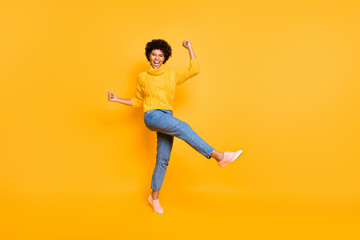 Fototapeta na wymiar Full length body size view of her she nice attractive charming cheerful cheery ecstatic wavy-haired girl celebrating luck having fun isolated on bright vivid shine vibrant yellow color background