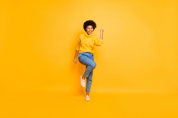 Fototapeta na wymiar Full length body size view of her she nice attractive cute cheerful cheery ecstatic wavy-haired girl celebrating good news victory isolated on bright vivid shine vibrant yellow color background