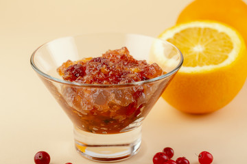 Orange jam with cranberry close-up, food swiss