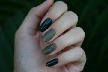 female hand with green nails